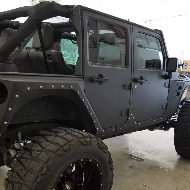 A black Jeep Wrangler had automotive window tinting installed at Advanced Window Tinting’s Jacksonville shop.