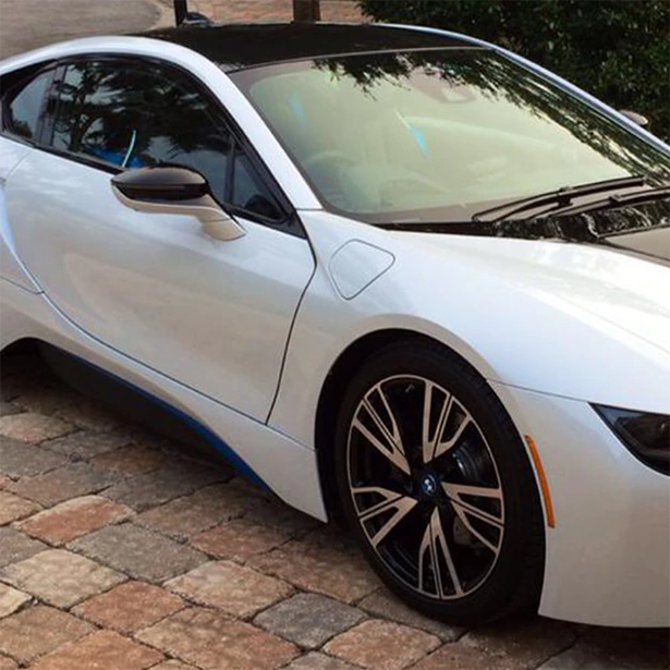 A white sports car had window tinting installed by Advanced Window Tinting.