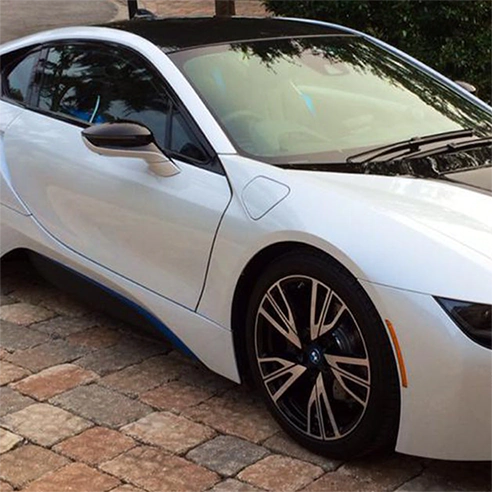 A white sports car had window tinting installed by Advanced Window Tinting.